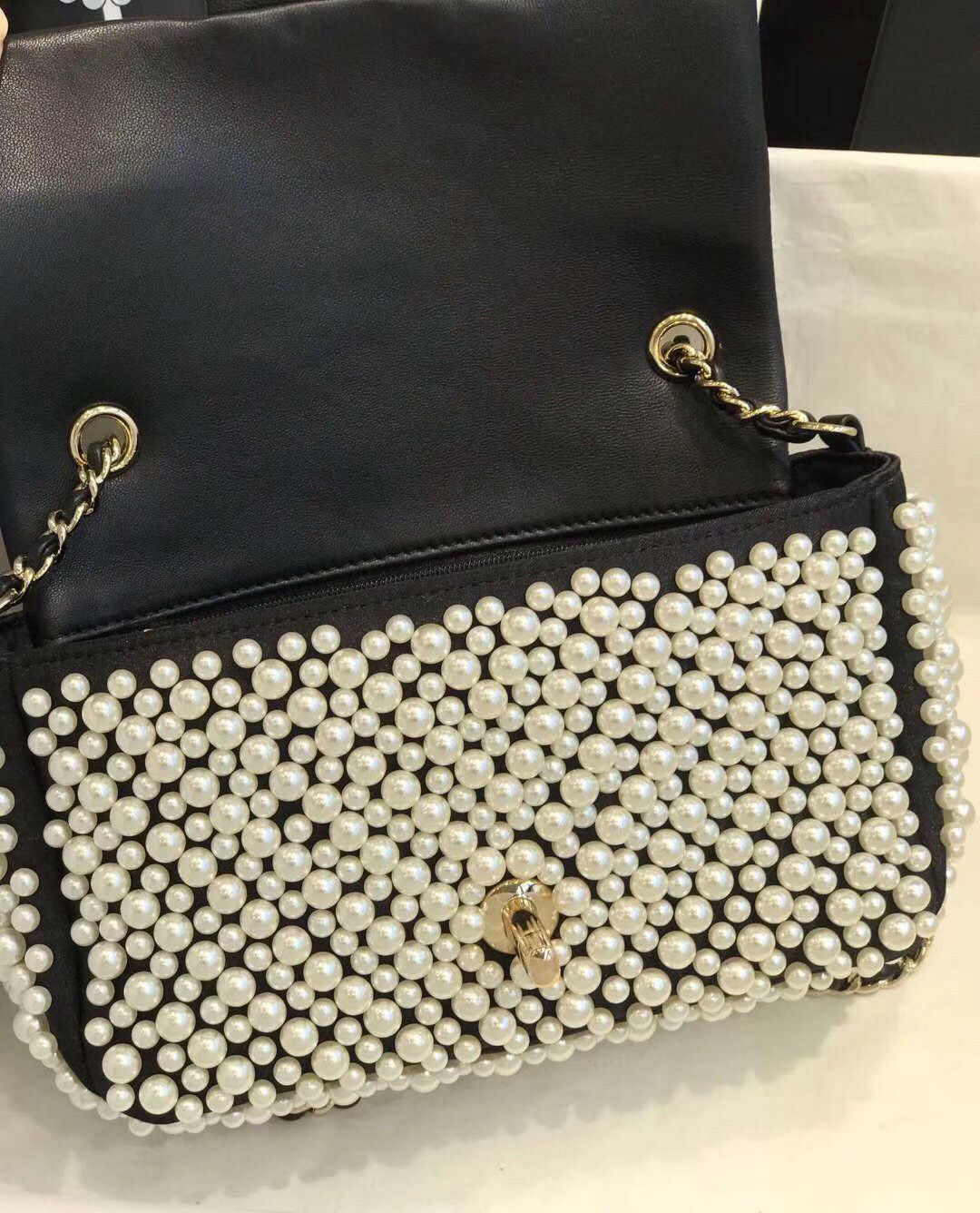 Chanel pearl on flap bag 5.9