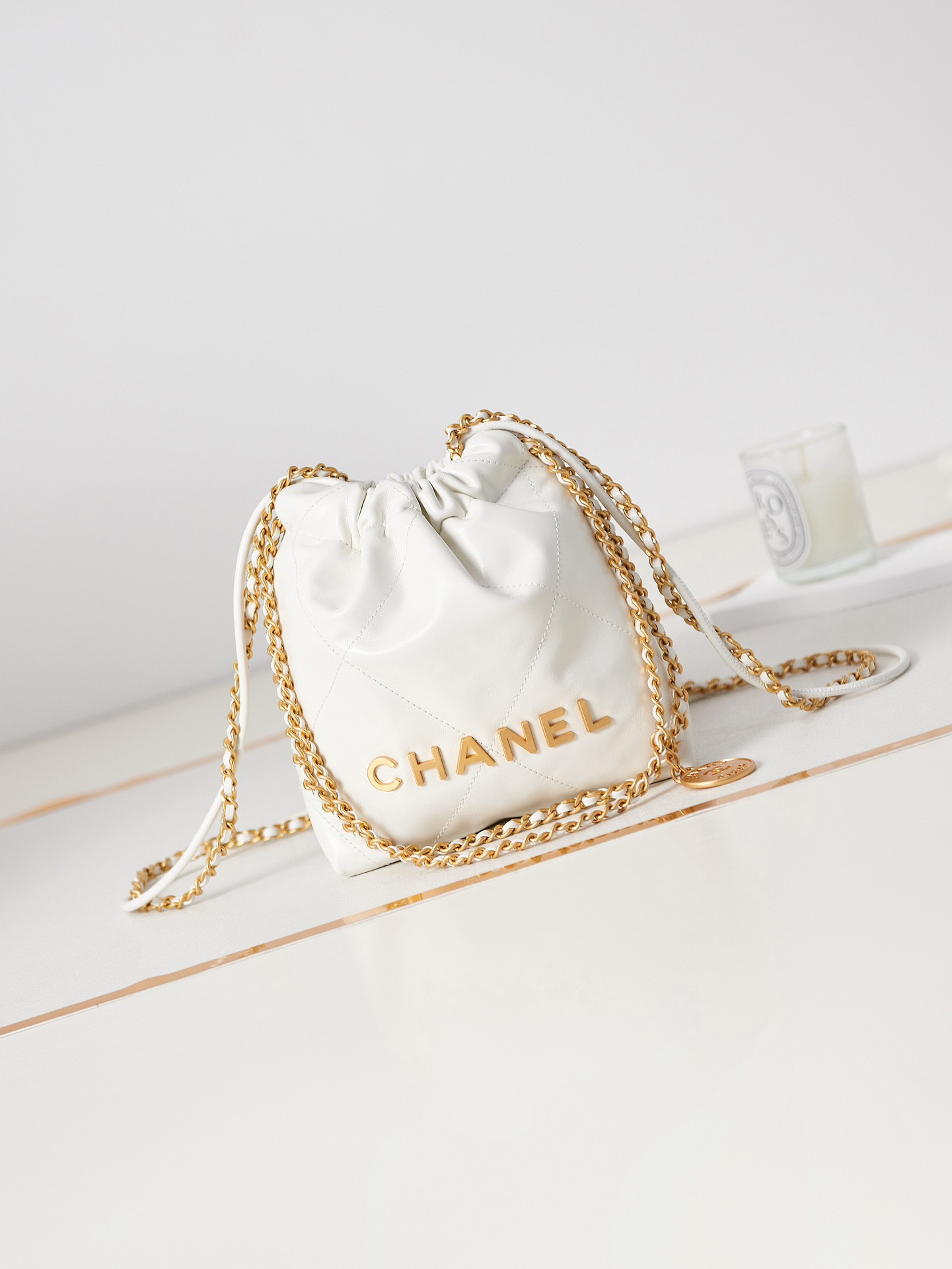 CHANEL 22 MINI HANDBAG Shiny Calfskin & Gold-Tone Metal white 7.8 × 7.4 × 2.3 in
