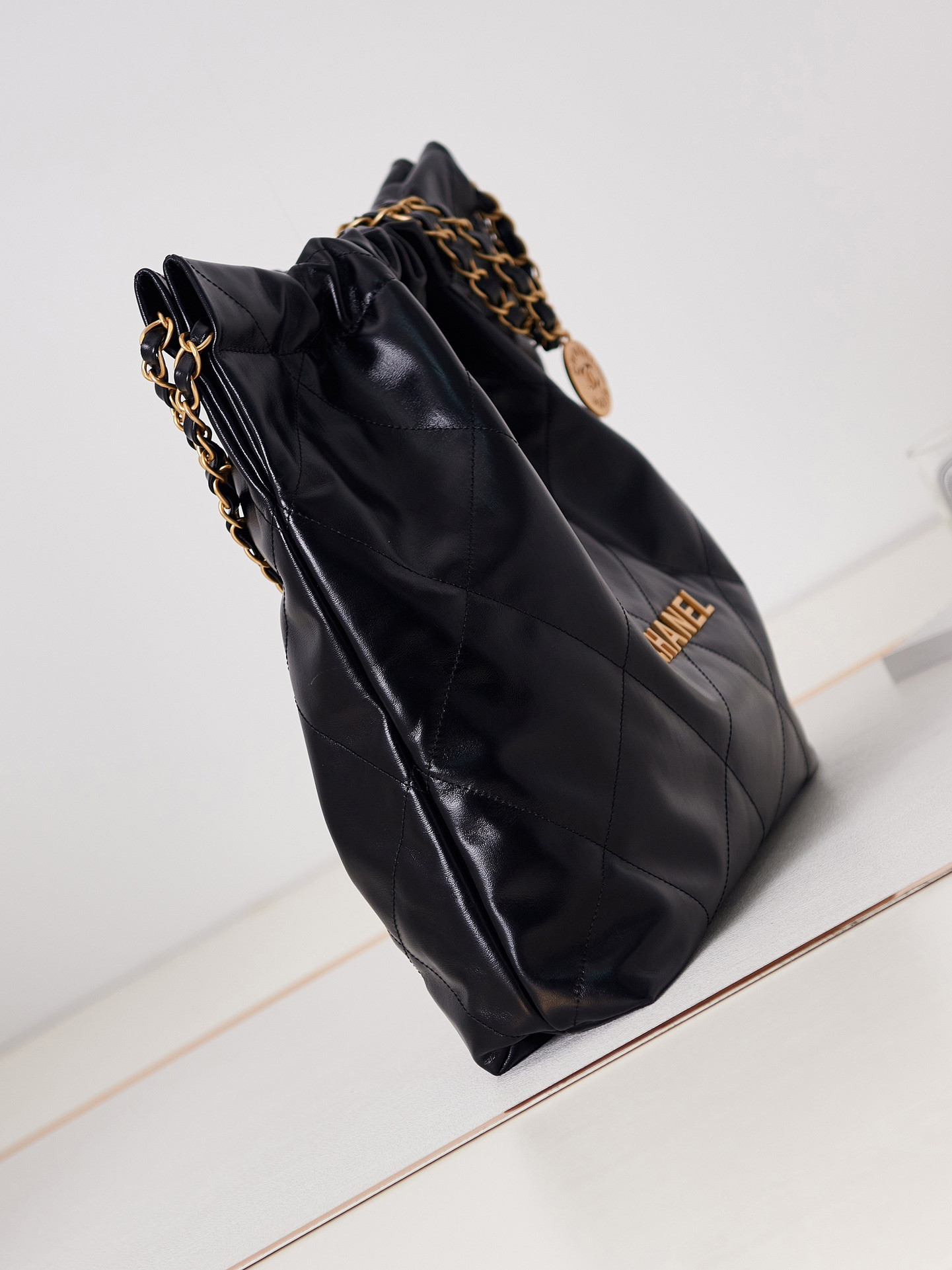 CHANEL 22 HANDBAG Shiny Calfskin & Gold-Tone Metal Black 15.2×16.4×3.1 in
