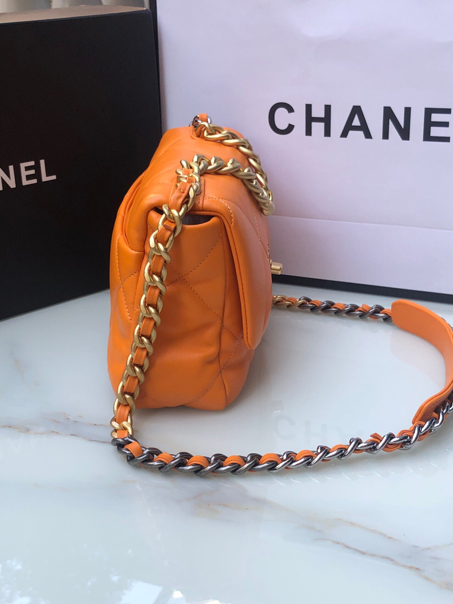 CHANEL 19 HANDBAG Shiny Leather, Gold-Tone, Silver-Tone & Ruthenium-Finish Metal Orange 6.2 × 10.1 × 3.5 in