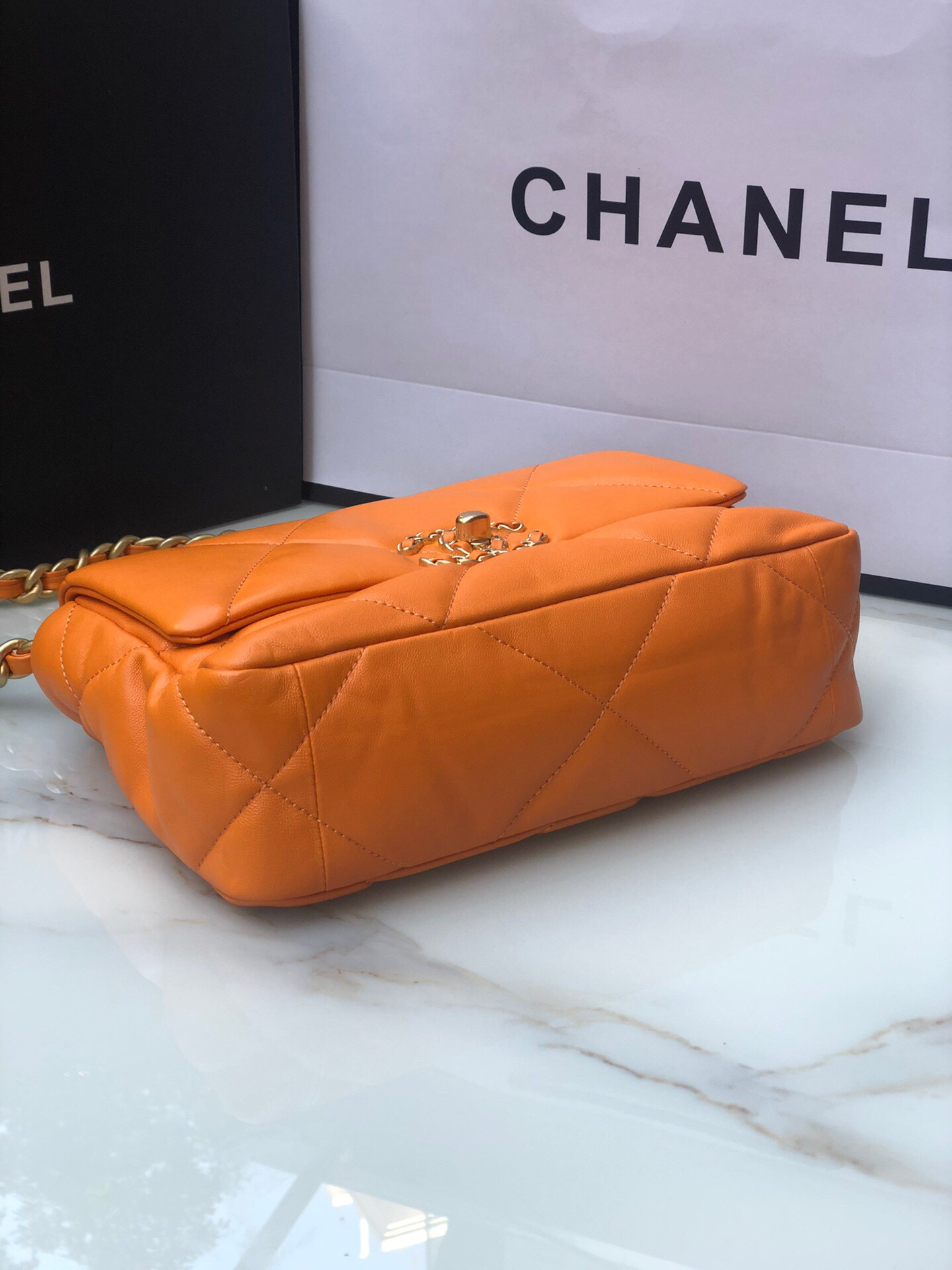 CHANEL 19 HANDBAG Shiny Leather, Gold-Tone, Silver-Tone & Ruthenium-Finish Metal Orange 6.2 × 10.1 × 3.5 in