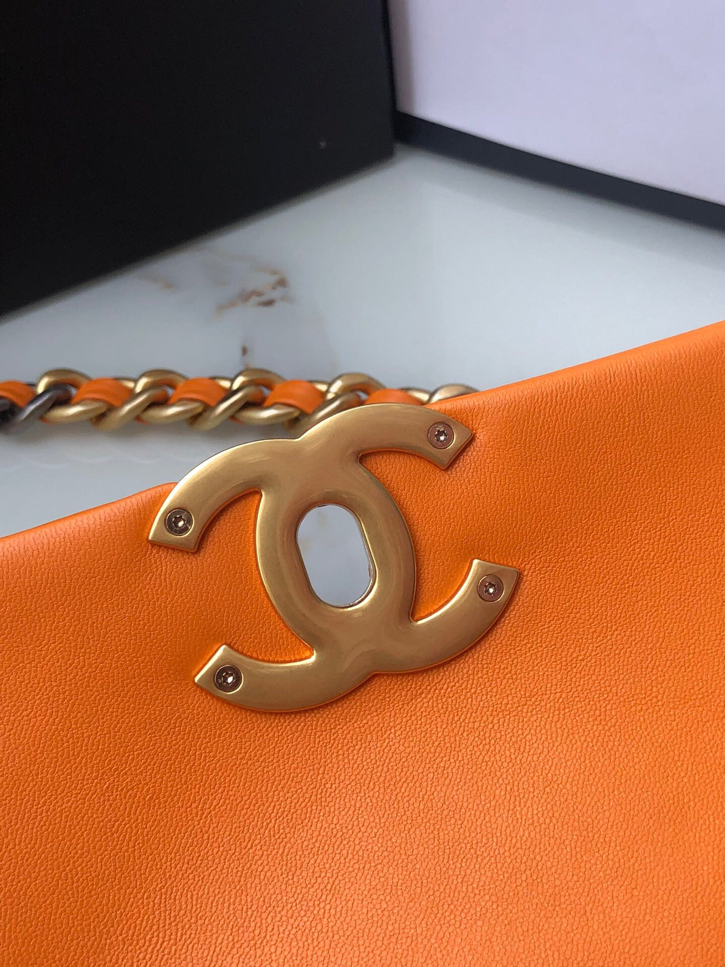 CHANEL 19 HANDBAG Shiny Leather, Gold-Tone, Silver-Tone & Ruthenium-Finish Metal Orange 6.2 × 10.1 × 3.5 in