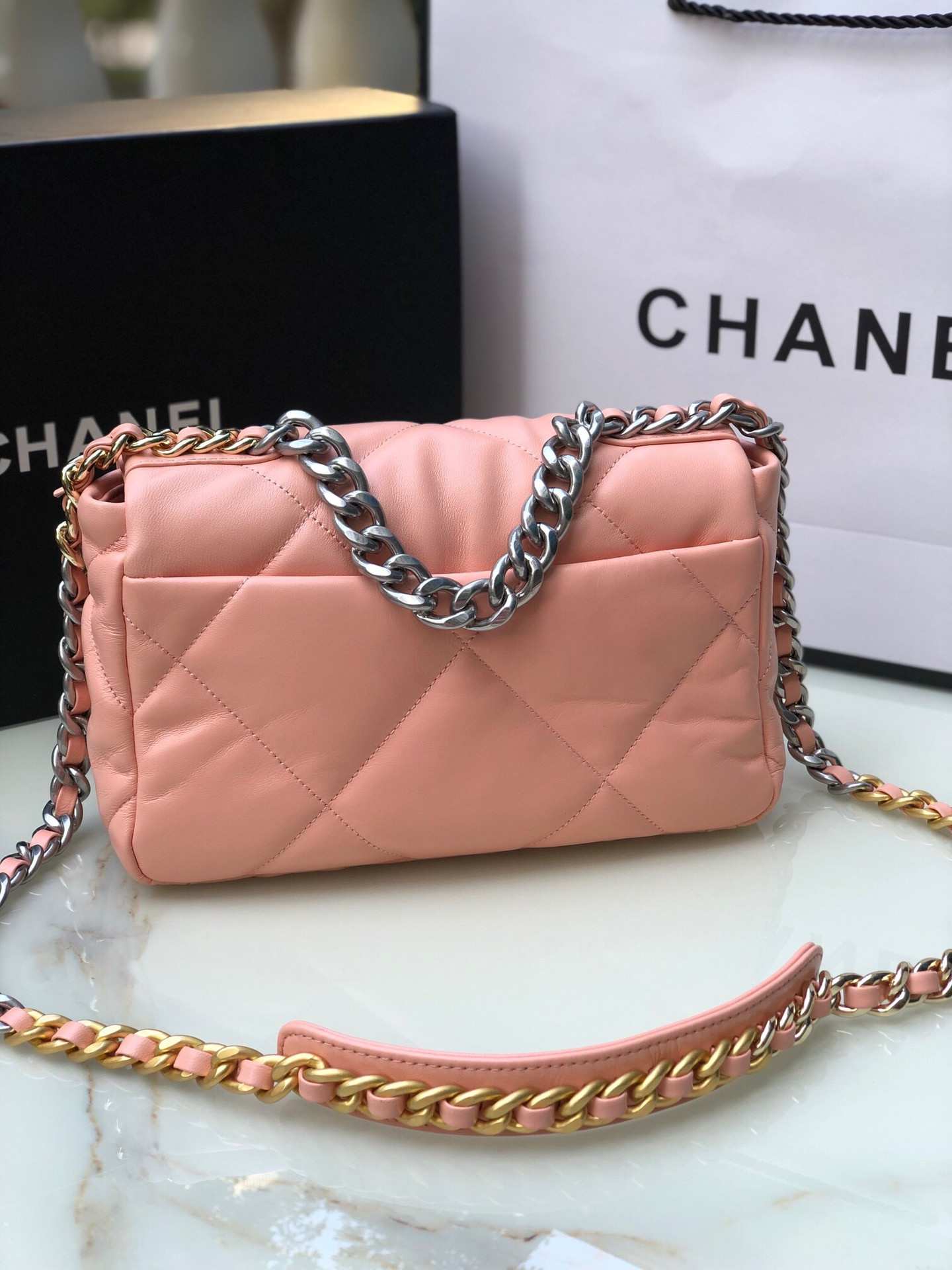 CHANEL 19 HANDBAG Shiny Leather, Gold-Tone, Silver-Tone & Ruthenium-Finish Metal Light Pink 6.2 × 10.1 × 3.5 in