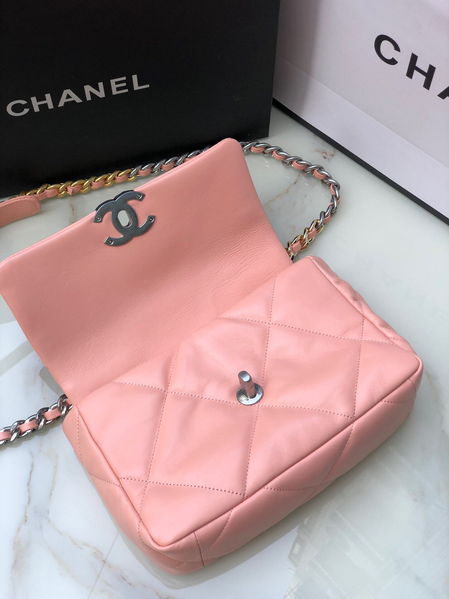CHANEL 19 HANDBAG Shiny Leather, Gold-Tone, Silver-Tone & Ruthenium-Finish Metal Light Pink 6.2 × 10.1 × 3.5 in
