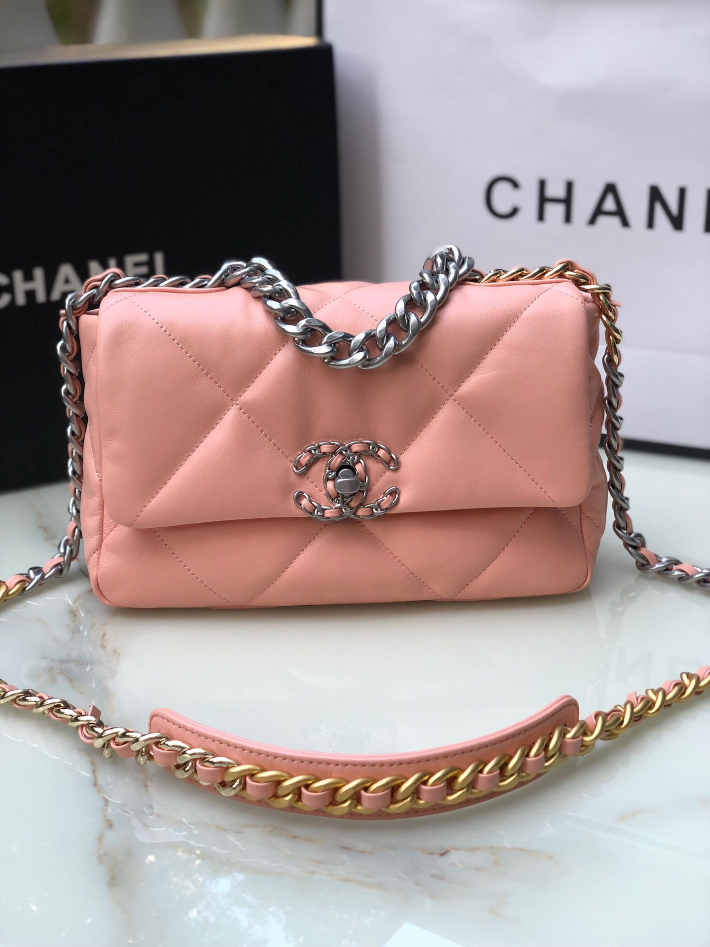 CHANEL 19 HANDBAG Shiny Leather, Gold-Tone, Silver-Tone & Ruthenium-Finish Metal Light Pink 6.2 × 10.1 × 3.5 in