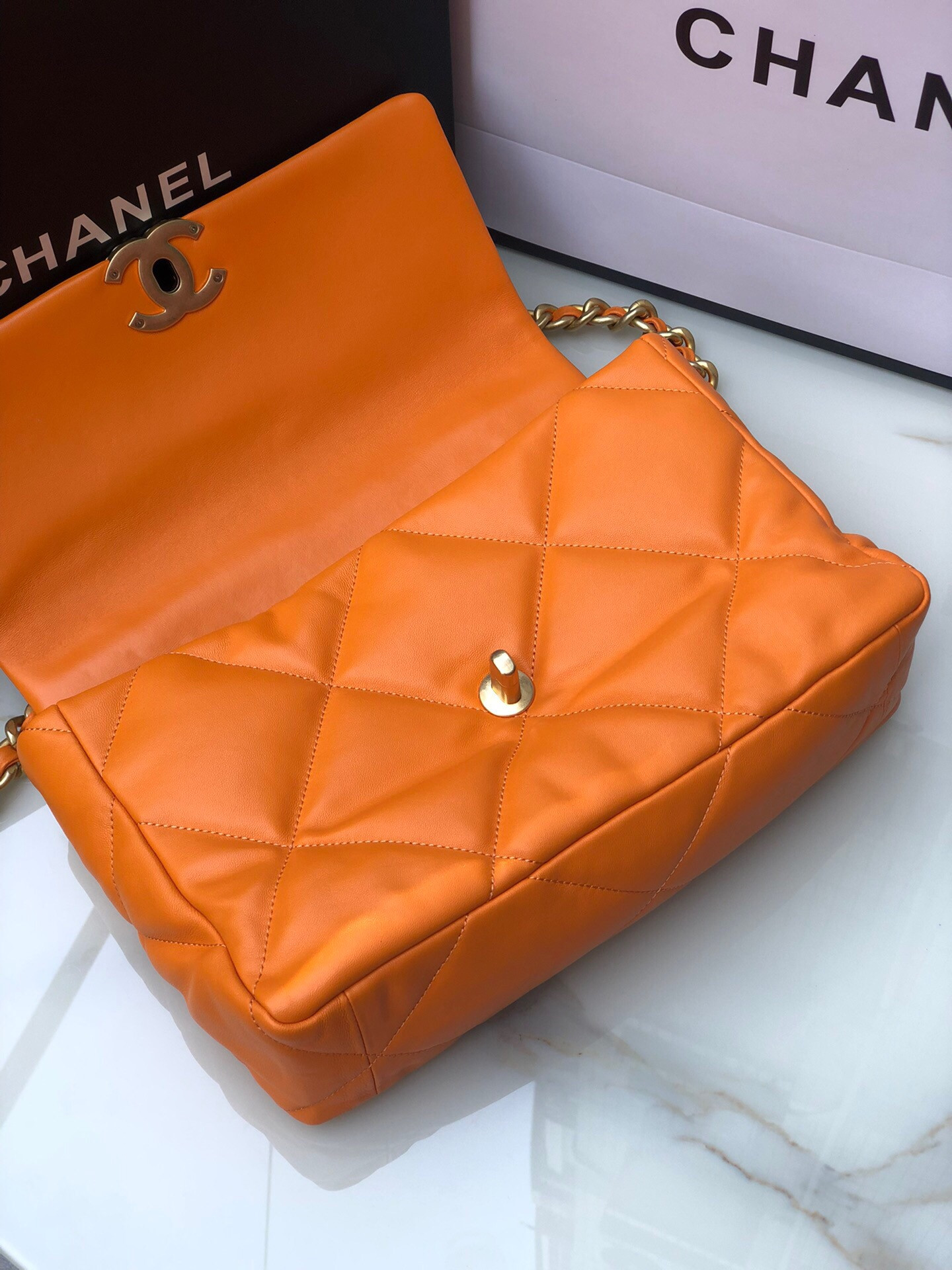 CHANEL 19 LARGE HANDBAG Shiny Leather, Gold-Tone, Silver-Tone & Ruthenium-Finish Metal Orange 7.8 × 11.7 × 3.9 in