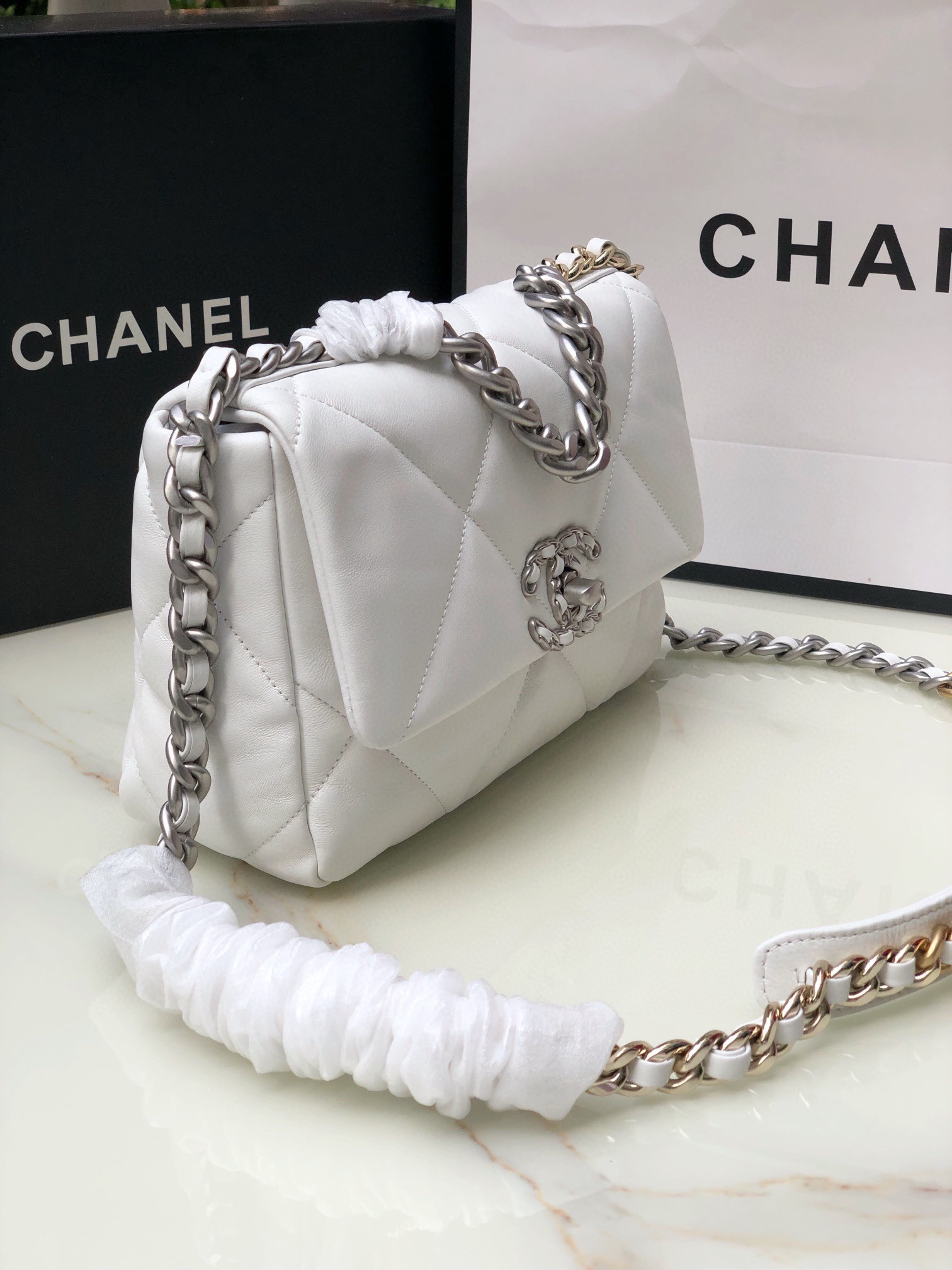 CHANEL 19 HANDBAG Shiny Leather, Gold-Tone, Silver-Tone & Ruthenium-Finish Metal White 6.2 × 10.1 × 3.5 in