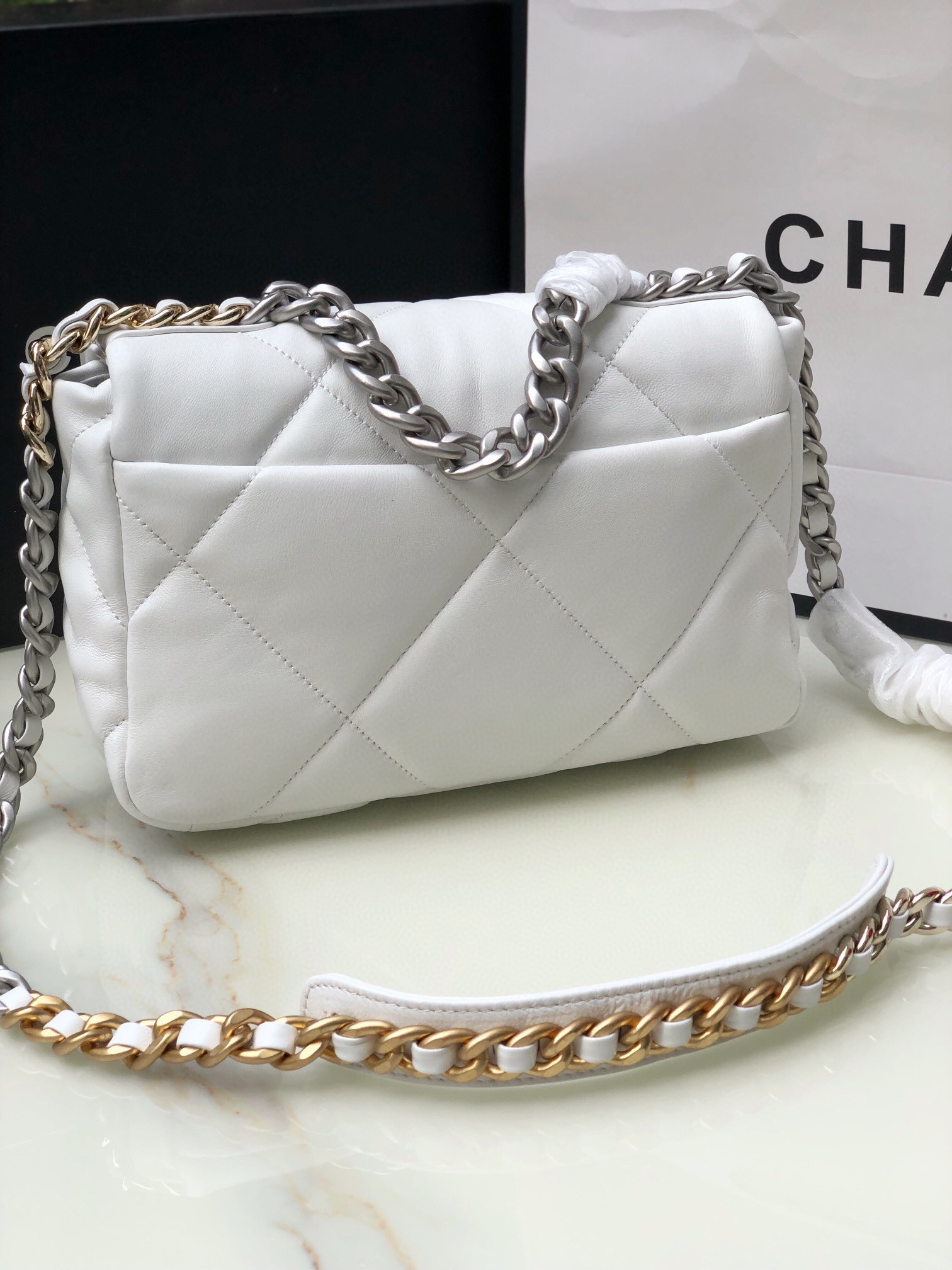 CHANEL 19 HANDBAG Shiny Leather, Gold-Tone, Silver-Tone & Ruthenium-Finish Metal White 6.2 × 10.1 × 3.5 in