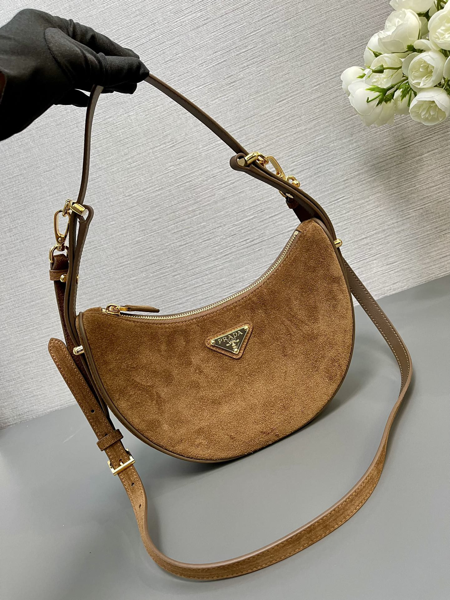 Prada Arqué suede shoulder bag 22.5x18.5x6.5cm