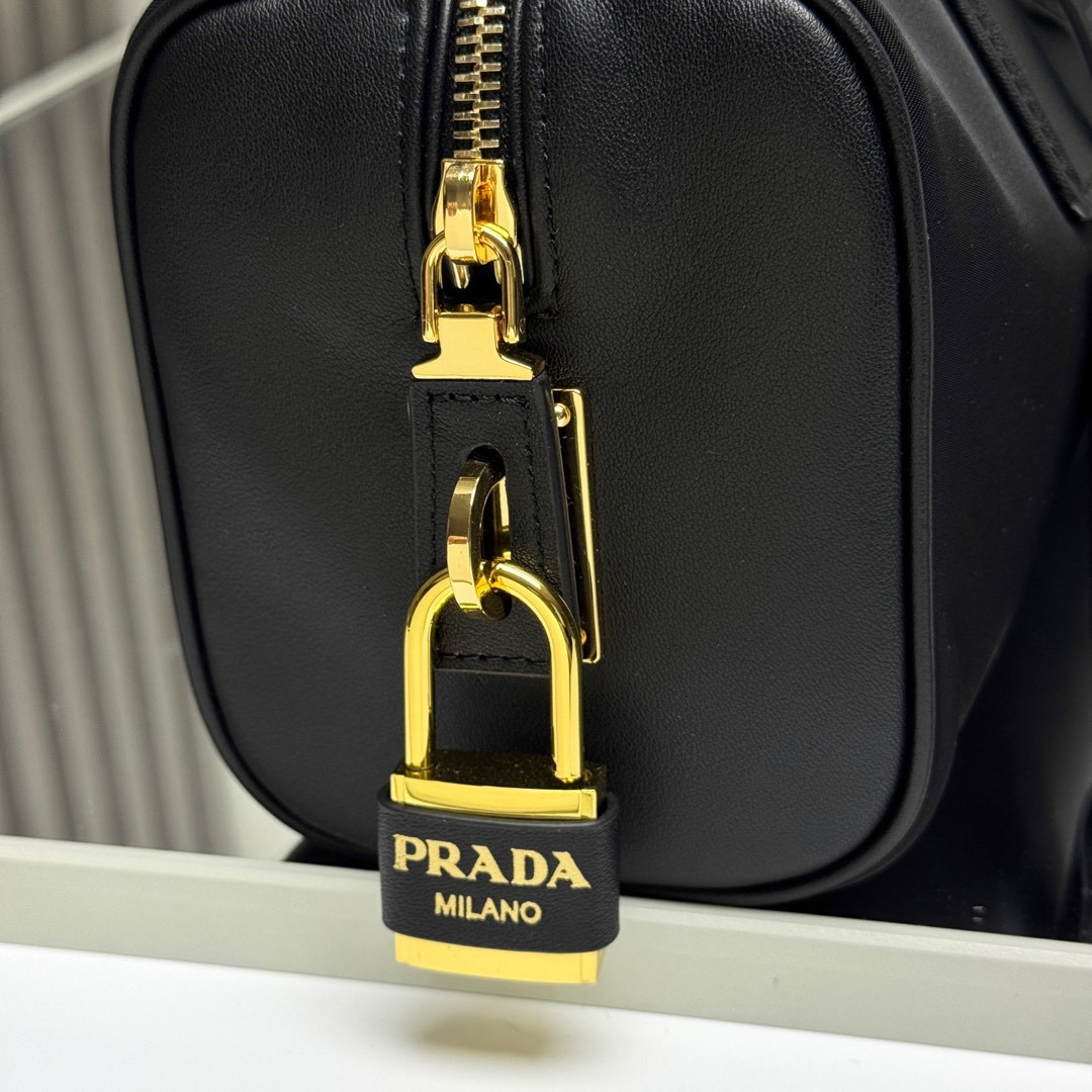 Prada Re-Nylon and leather medium top-handle bag with padlock 12.5x29x10cm