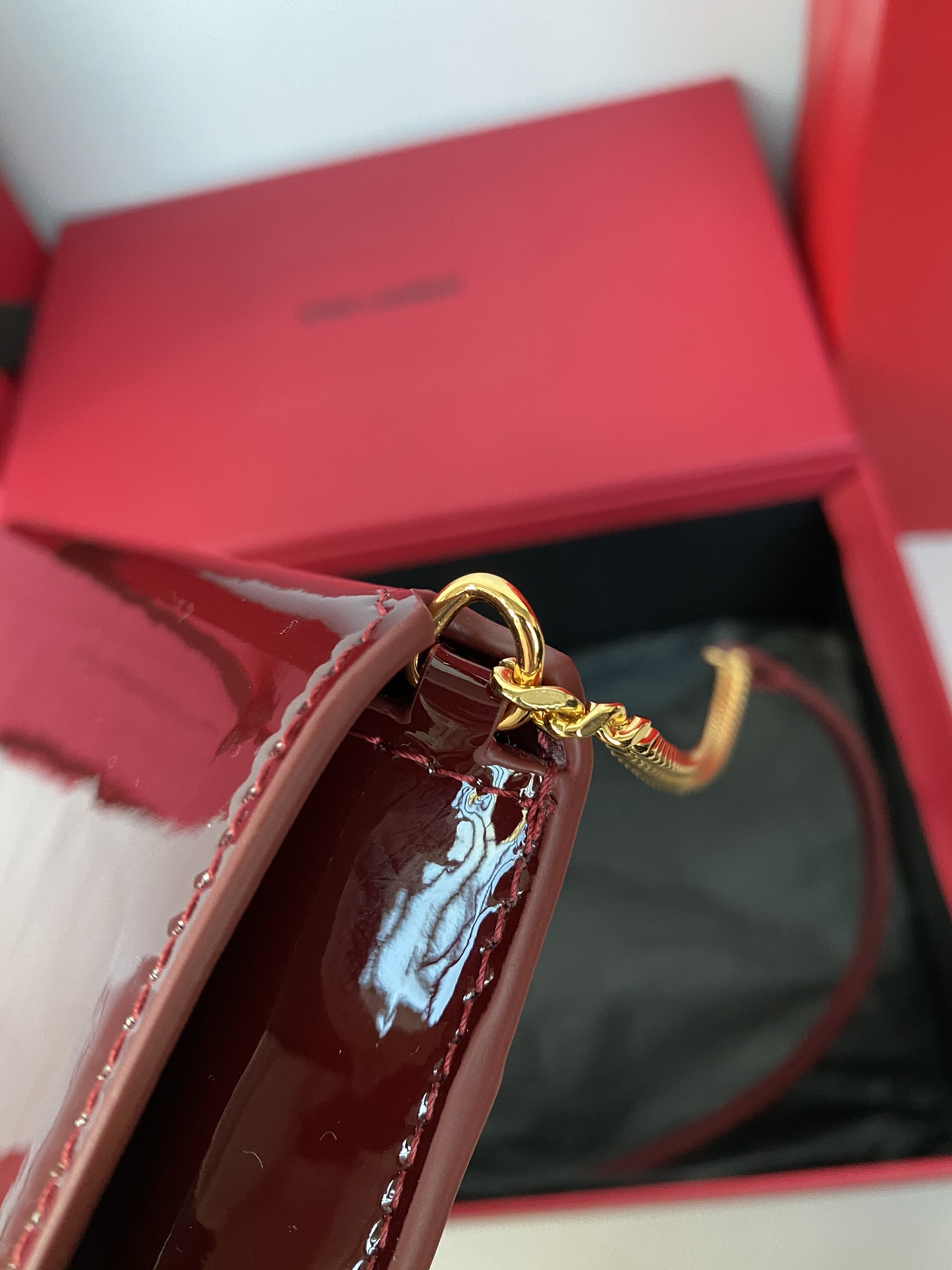 YSL Monogram phone holder with strap (patent leather) 18 x 11 x 2.5 CM